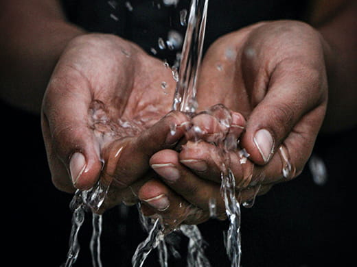 hands holding water