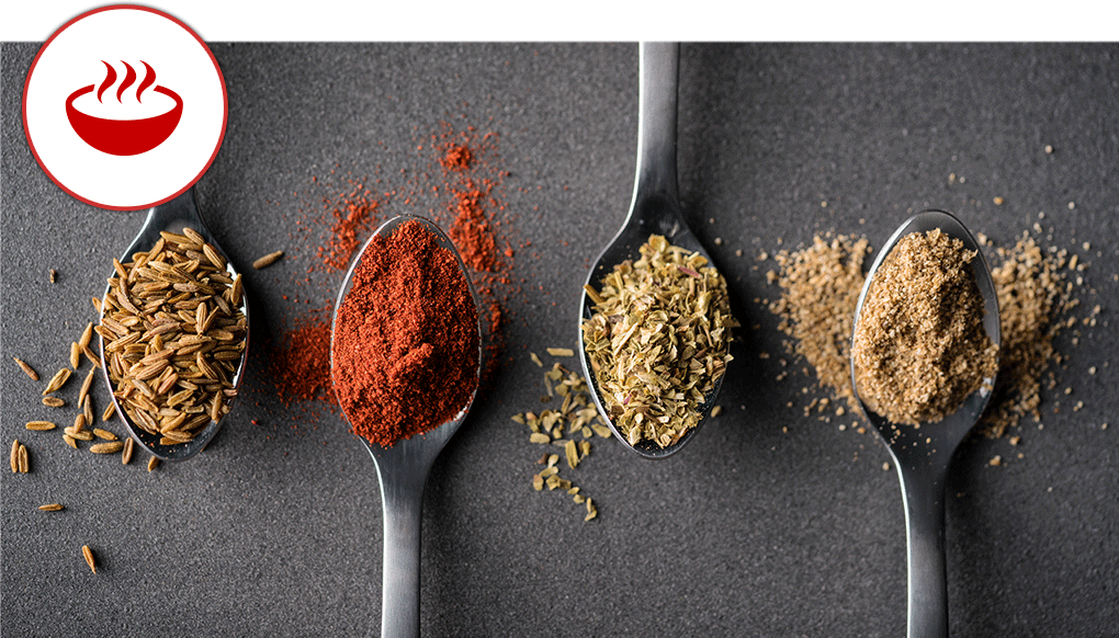 Colorful spices on spoons