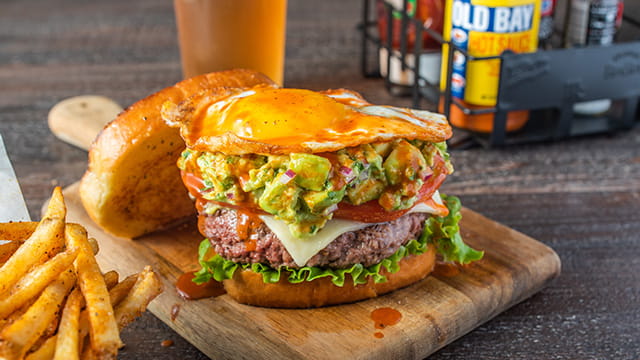 Fiery OLD BAY® Hot Sauce Guacamole Burger On Butter Texas Toast