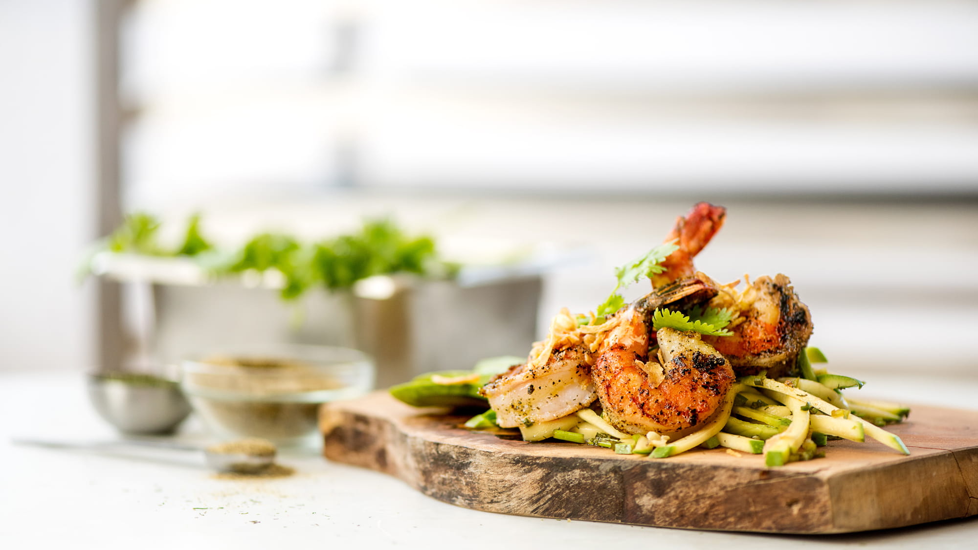 Grilled Black Pepper Shrimp with Green Mango and Avocado Slaw