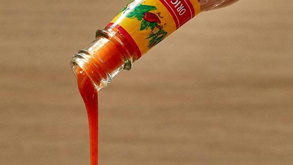cholula bottle pouring sauce