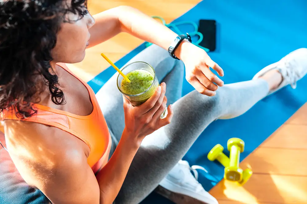 woman-working-out-with-smoothie-functional-performance-nutrition