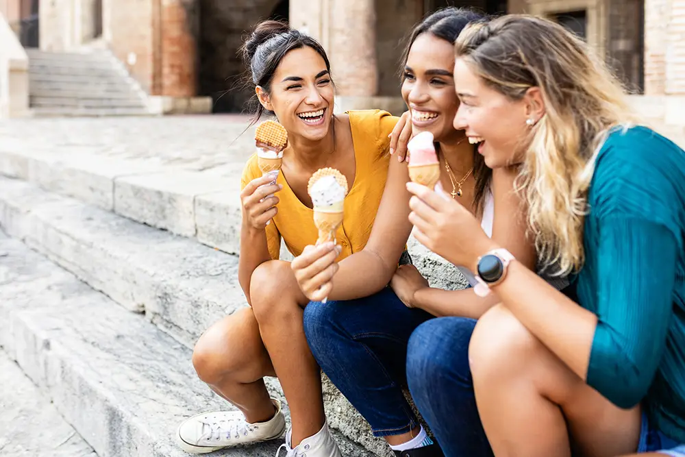 girls-group-of-friends-gen-z-eating-ice-cream-cones-together