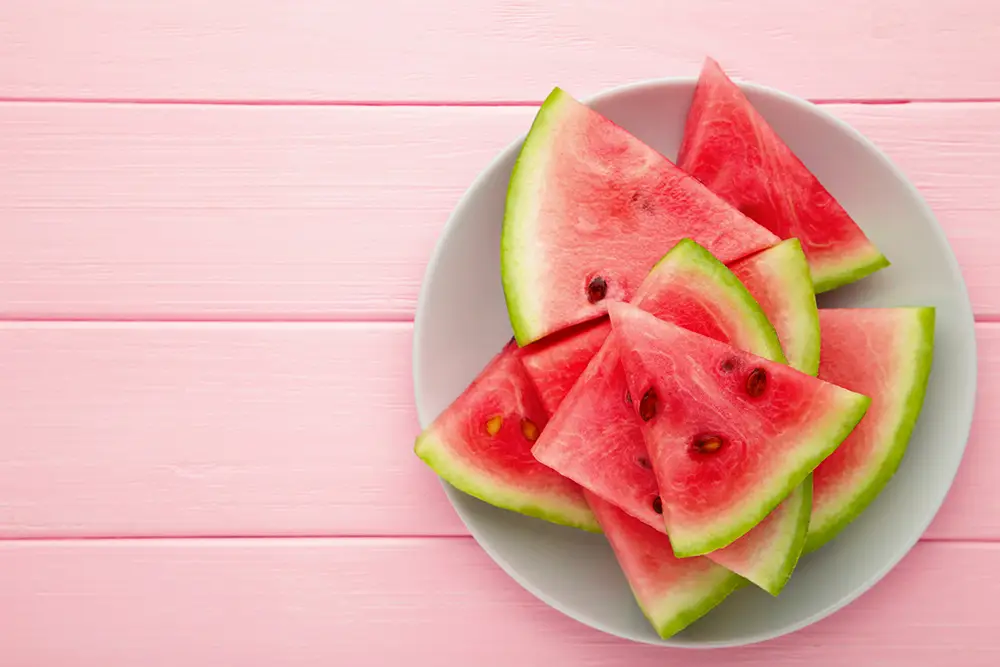 watermelon-on-pink-wood-background-